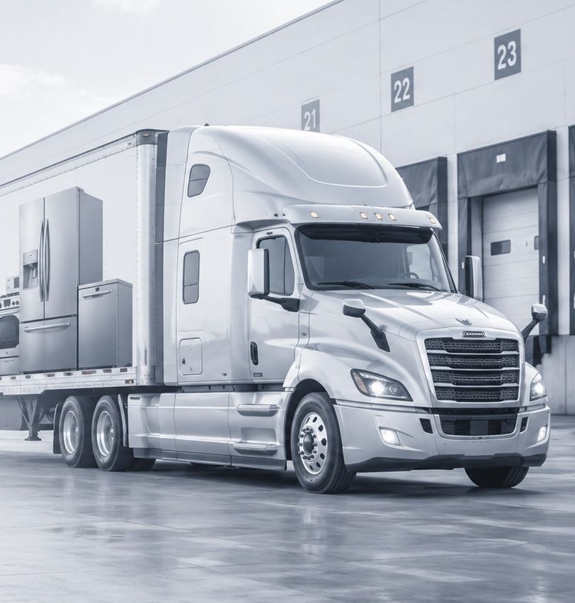 Cornerstone Logistics tractor-trailer waiting at numbered dock doors